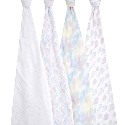 Four aden + anais organic cotton muslin swaddles displayed hanging, featuring pastel cloud and hot air balloon patterns. Breathable, lightweight, and gentle for baby.