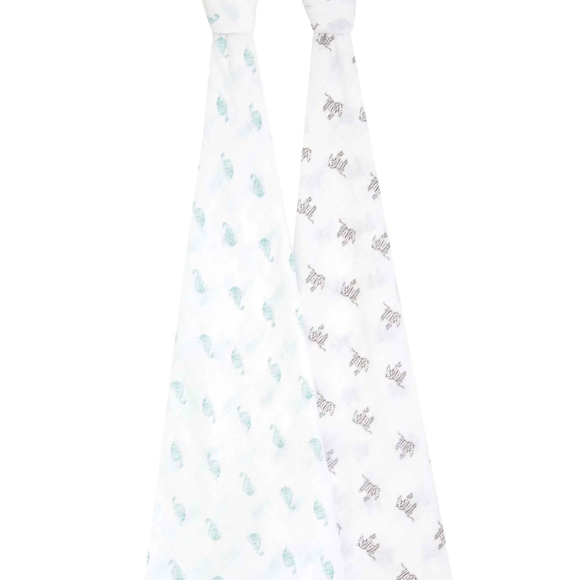 Full view of aden + anais 2-pack organic swaddles hanging side by side, with playful turtle and zebra hand-drawn prints.