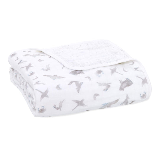 The aden + anais organic cotton muslin dream blanket features four layers of muslin for a soft baby blanket. Its uses go beyond cuddling, as it also makes a snuggly surface to lay your little one on.