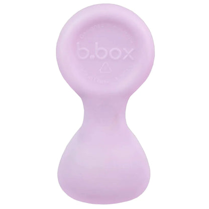 Single baby spoon shown upright in a pale purple shade with a rounded handle and wide scoop.