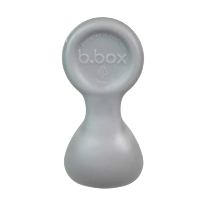 Single baby weaning spoon shown upright in a soft grey shade with a smooth rounded handle and broad scoop.