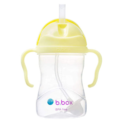 The b.box Sippy Cup in the Banana Split colourway shown upright with a clear body, pink easy-grip handles, and a visible weighted straw inside.