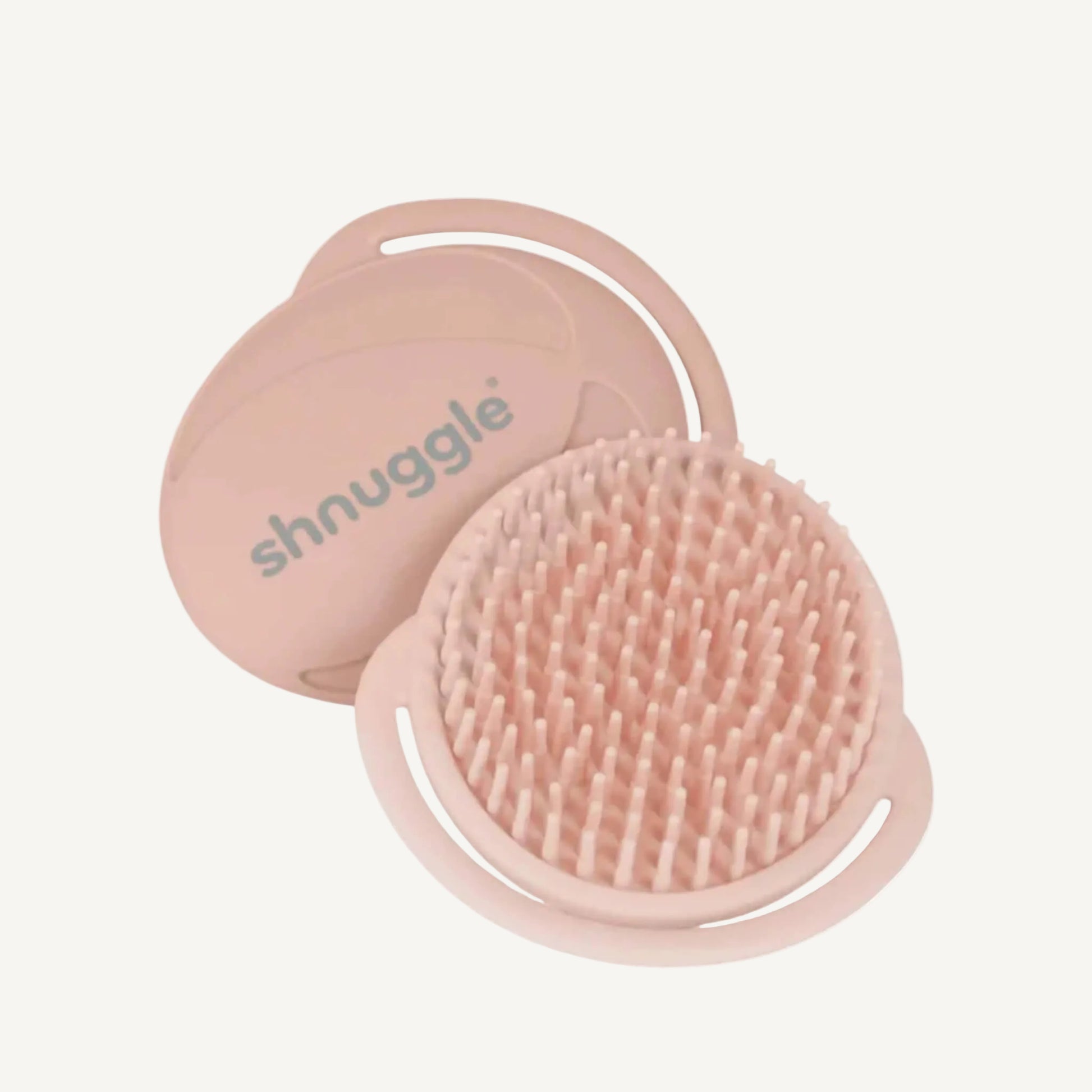 Pink silicone baby bath brush with flexible soft bristles designed for delicate newborn scalps and cradle cap care.