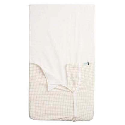 ergoPouch Hug Me Blanket in caramel grid print, showing soft cotton fabric with two-tone design.