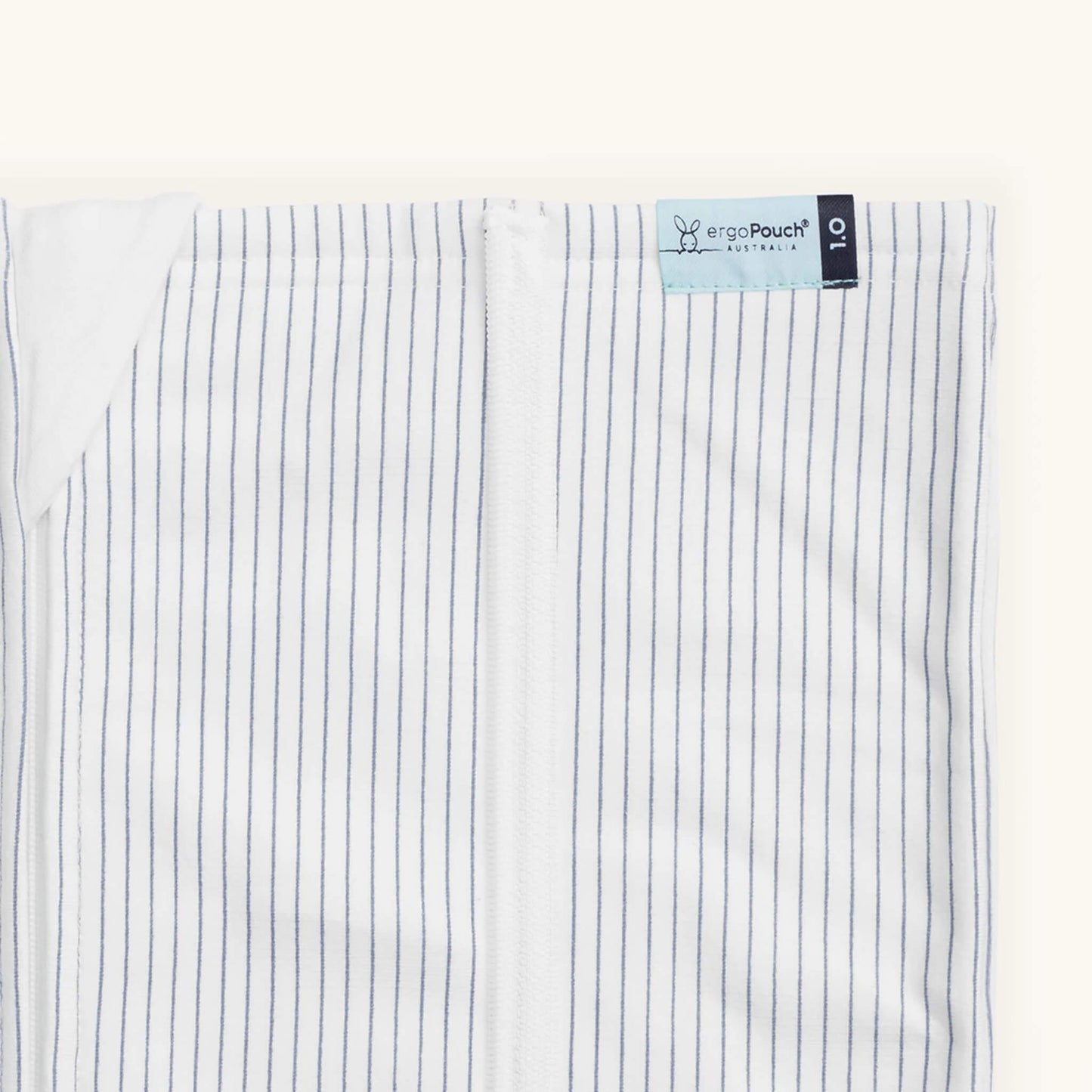 Close-up of the ergoPouch HugMe Blanket in midnight stripe, showing the fine pinstripe detail and zip closure.