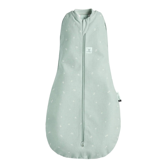 Ergopouch Summer Cocoon Swaddle Bag in sage green, decorated with a white leaf pattern, shown flat with a central zip and soft cotton finish.