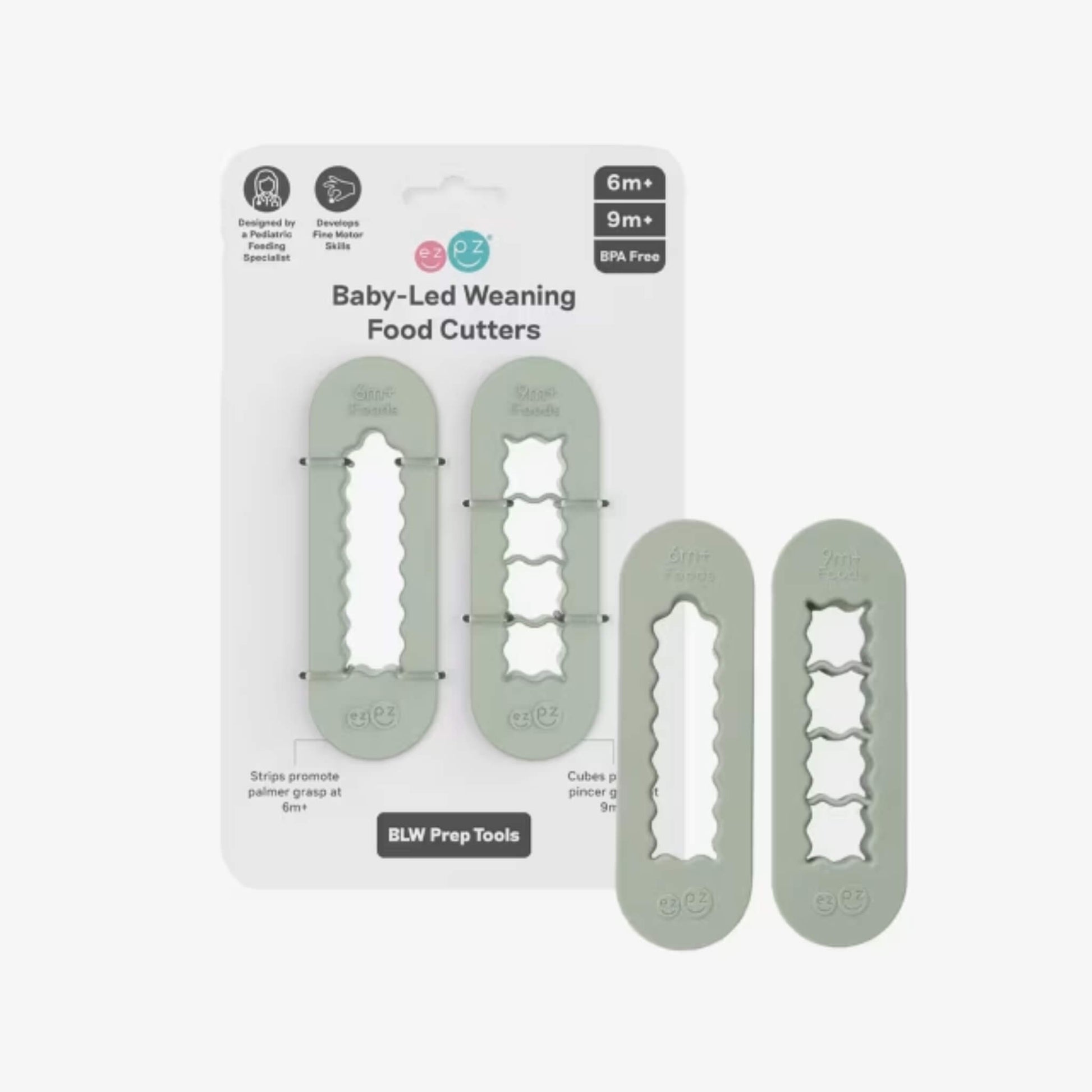 Sage green baby-led weaning food cutters displayed in retail packaging showing strip cutter and cube cutter designed for preparing baby finger foods.