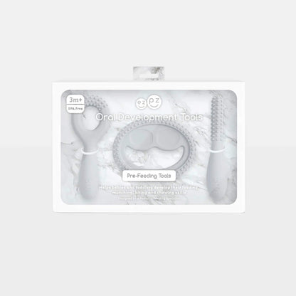 Grey silicone oral development tools displayed in retail packaging labelled oral development tools for babies 3+ months designed to support early feeding skills.