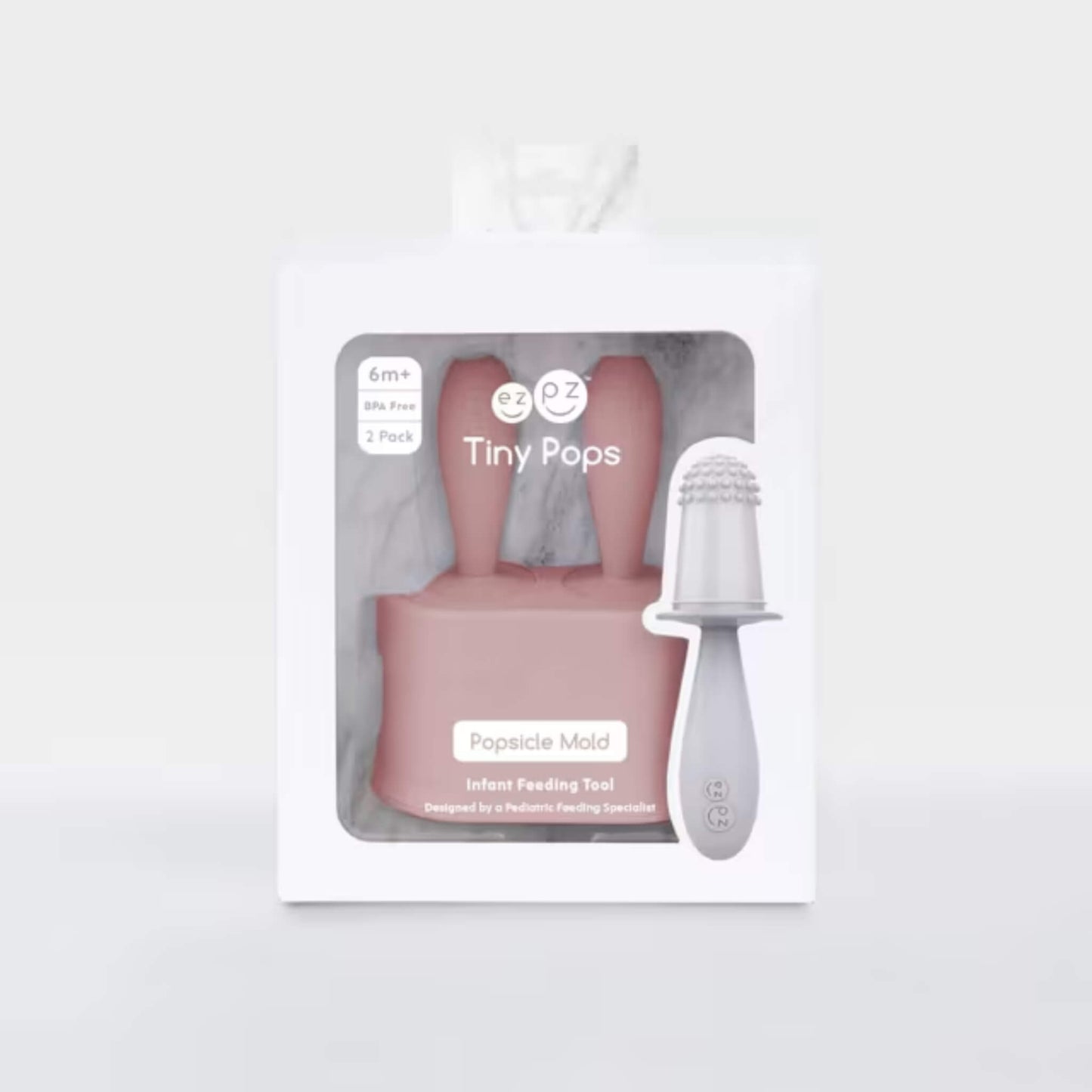 Retail packaging for baby popsicle mould set with blush silicone handles and infant feeding popsicle tool displayed inside box.