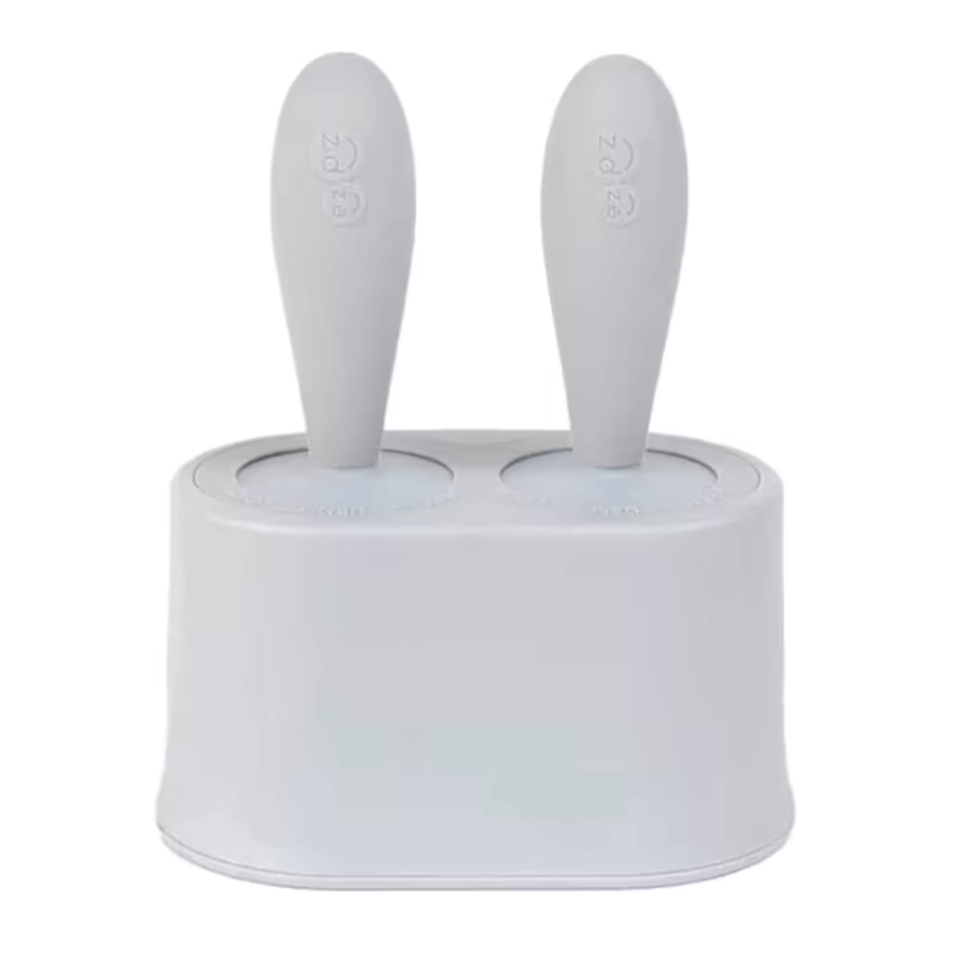 Ezpz Tiny Pops silicone baby popsicle mould set with two handles inserted into compact freezer stand designed for baby-led weaning portions.