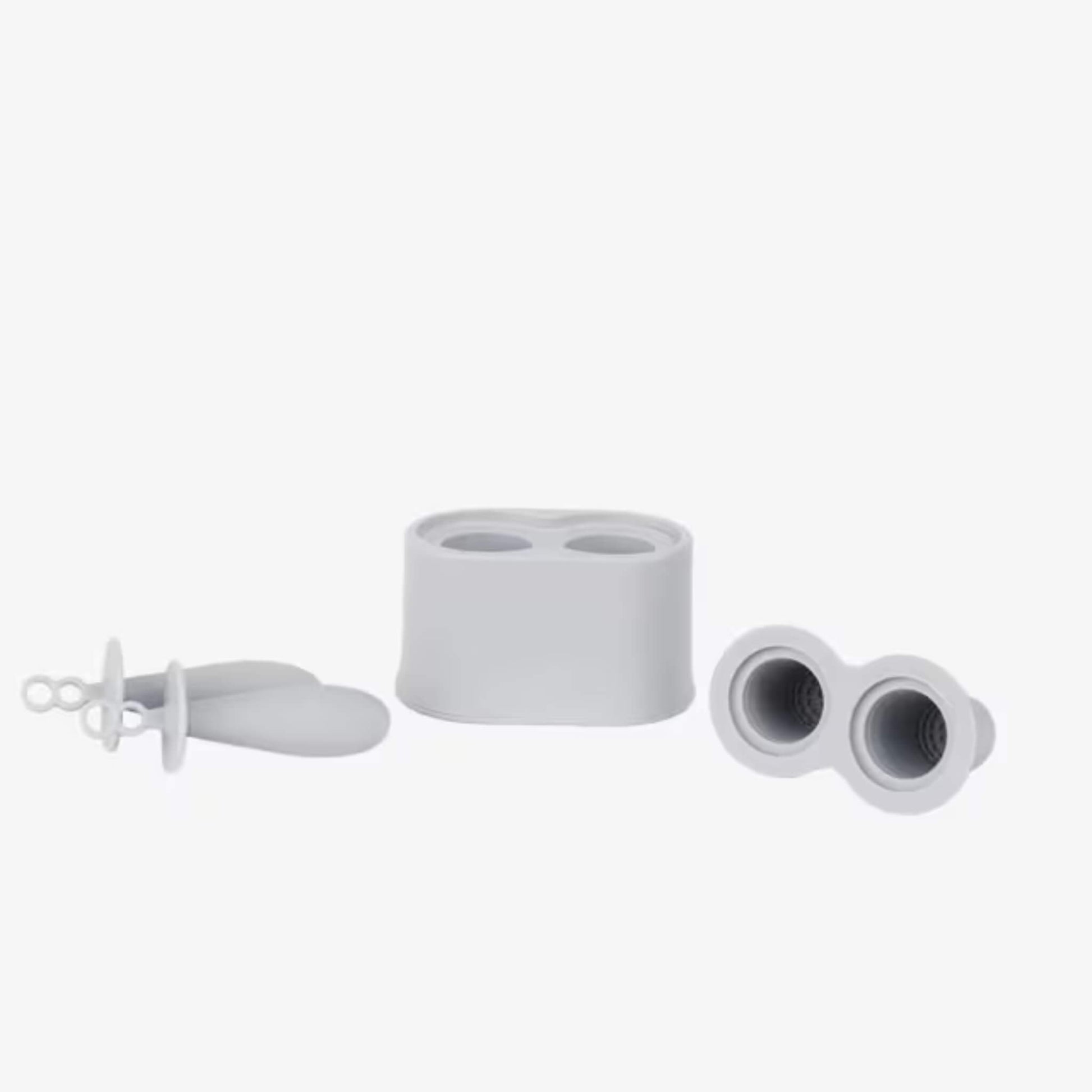 Silicone baby popsicle mould components including freezer base, lids and feeding handles arranged to show parts.