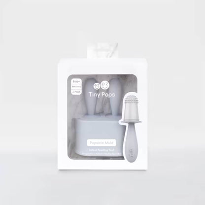 Boxed baby popsicle mould set displayed in retail packaging showing silicone mould and feeding handle.
