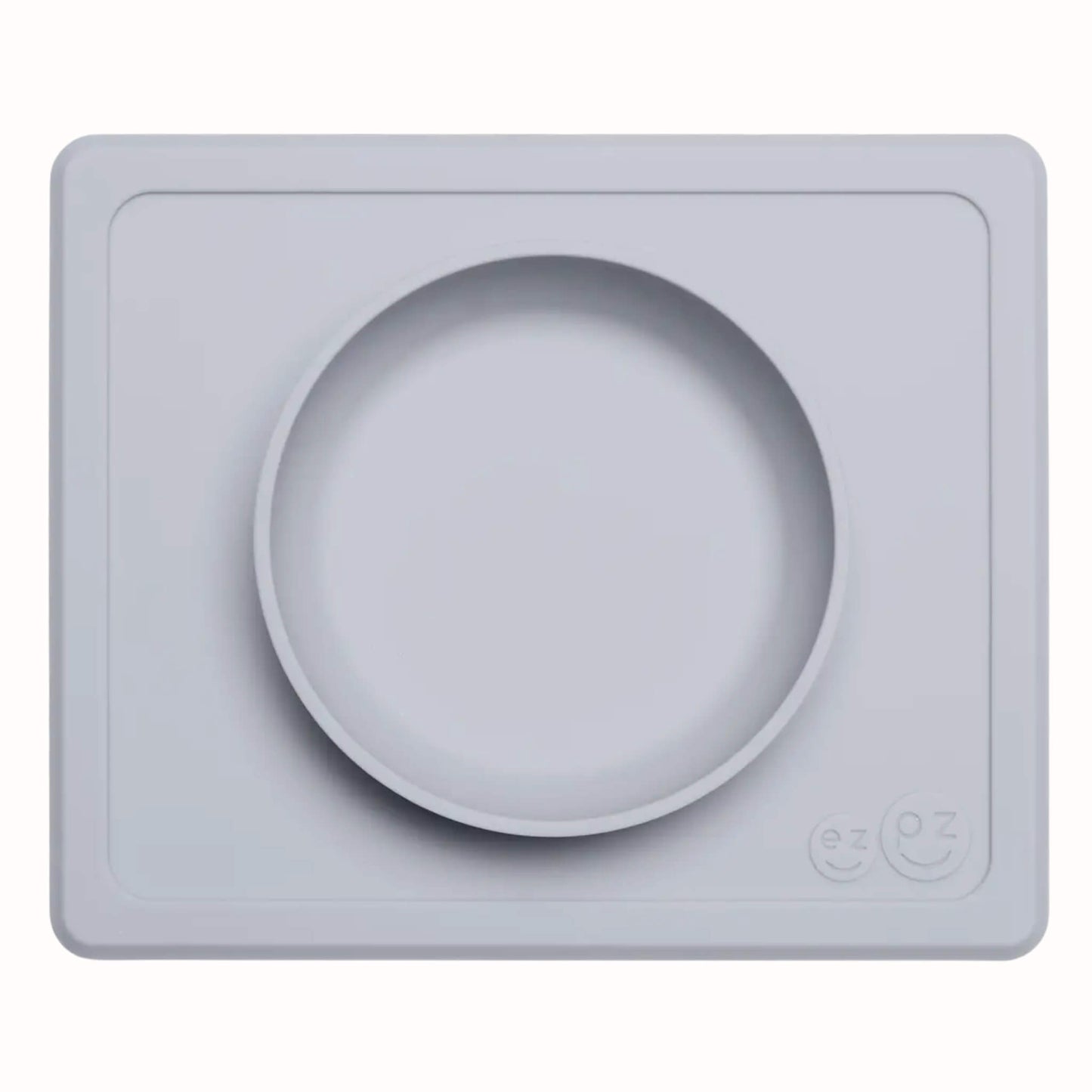 Pewter silicone suction bowl with matching rectangular placemat designed for toddler meals and snacks.