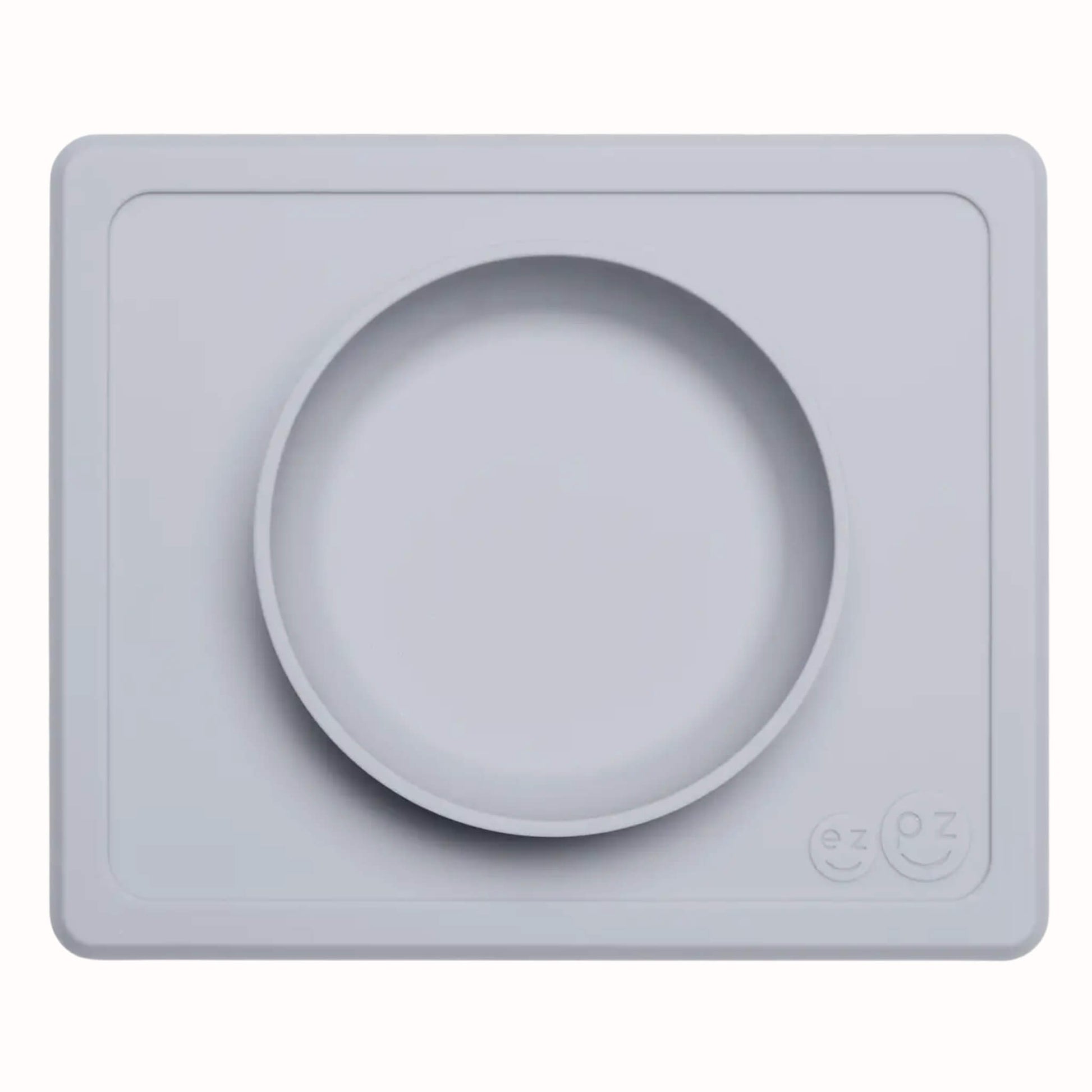 Pewter silicone suction bowl with matching rectangular placemat designed for toddler meals and snacks.