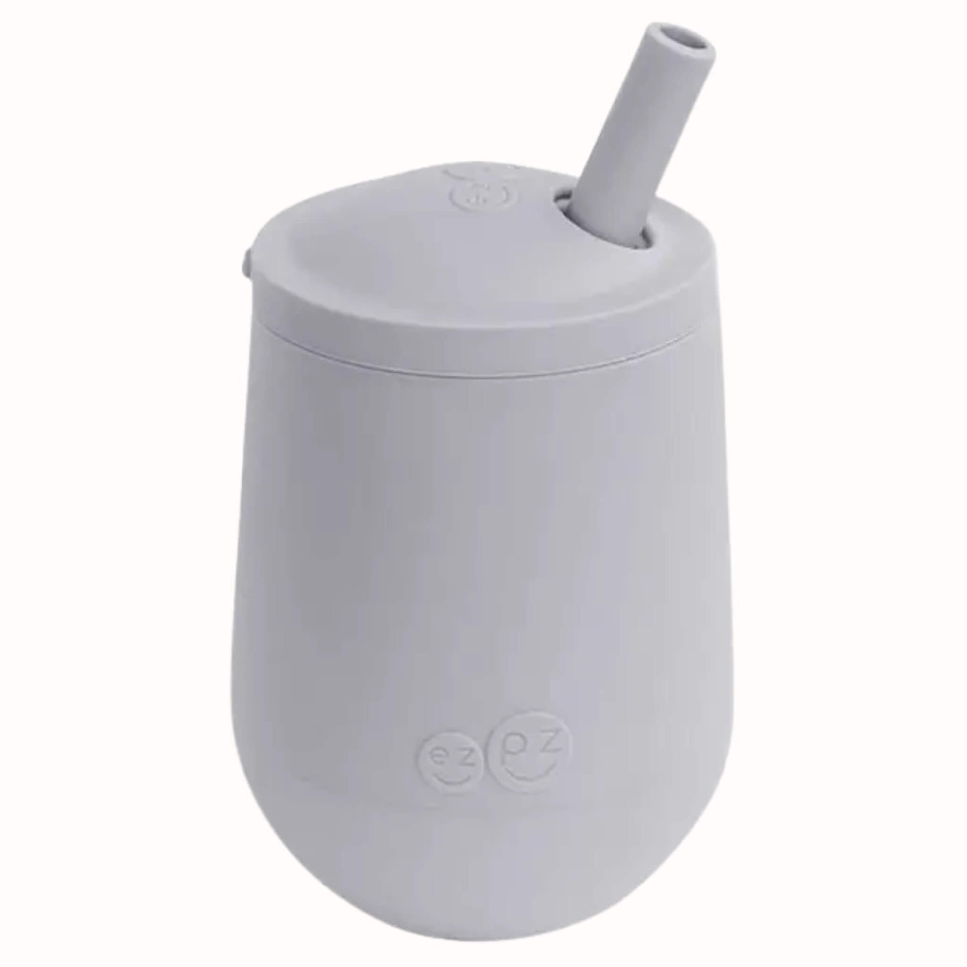 Pewter silicone mini cup with angled straw lid designed to help toddlers learn open cup and straw drinking.