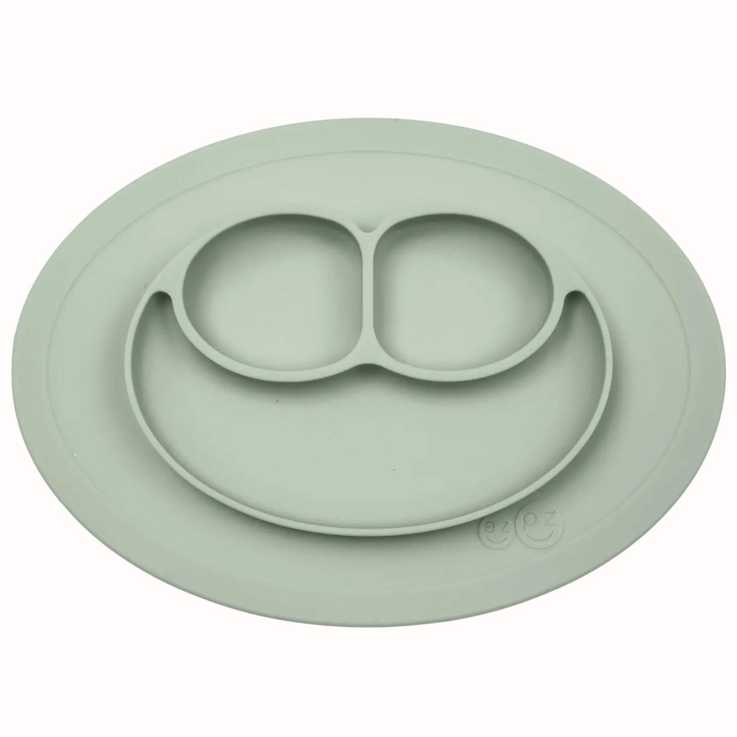 Silicone divided mini mat in sage with separate food sections designed for toddler meals and snacks.