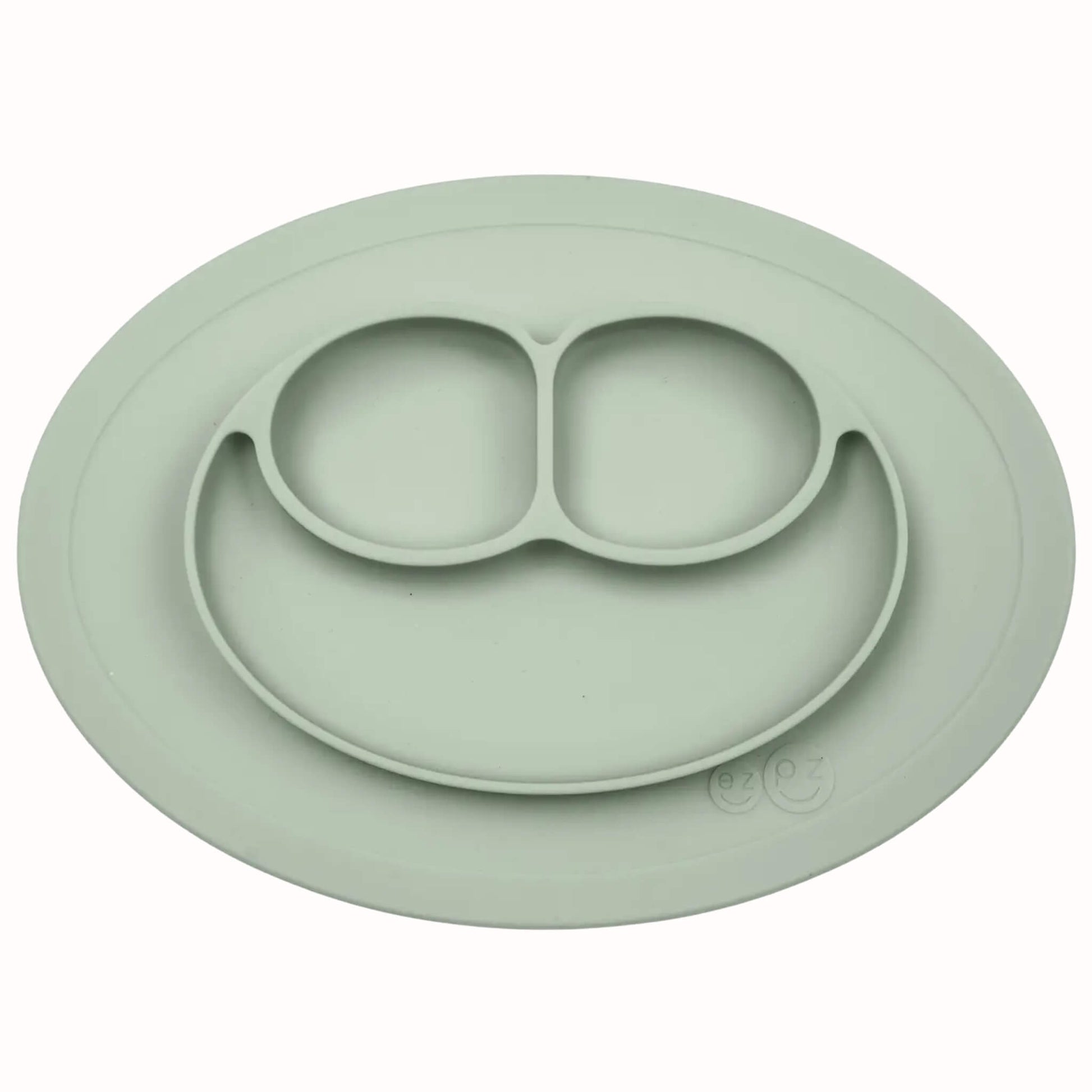Silicone divided mini mat in sage with separate food sections designed for toddler meals and snacks.