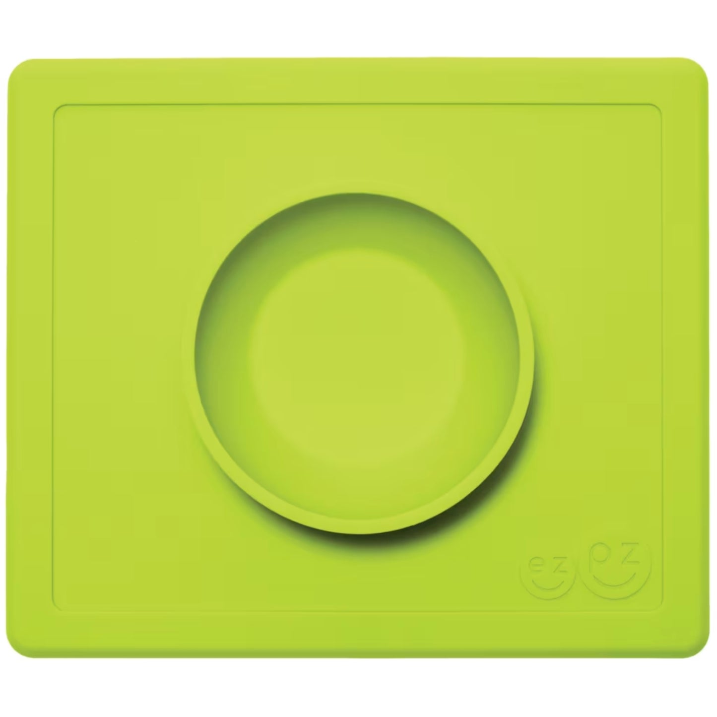 ezpz Happy Bowl in lime. A round silicone bowl is built into a rectangular placemat with the ezpz smiley face logo embossed in the corner.