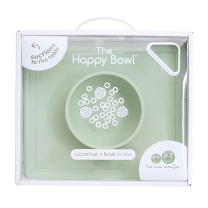 Retail packaging box showing the Happy Bowl in sage. The front displays a product illustration, the name “The Happy Bowl” and the description placemat + bowl in one.