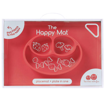 A retail box showing a coral red silicone placemat and plate combination labelled as the Happy Mat, with three illustrated food compartments.