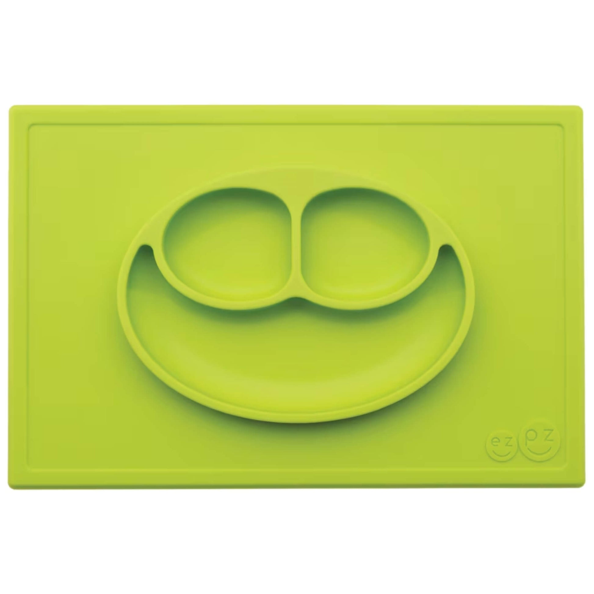 Ezpz Happy Mat in lime green, a silicone placemat and plate in one with three compartments in a smiley face design for toddler mealtimes.