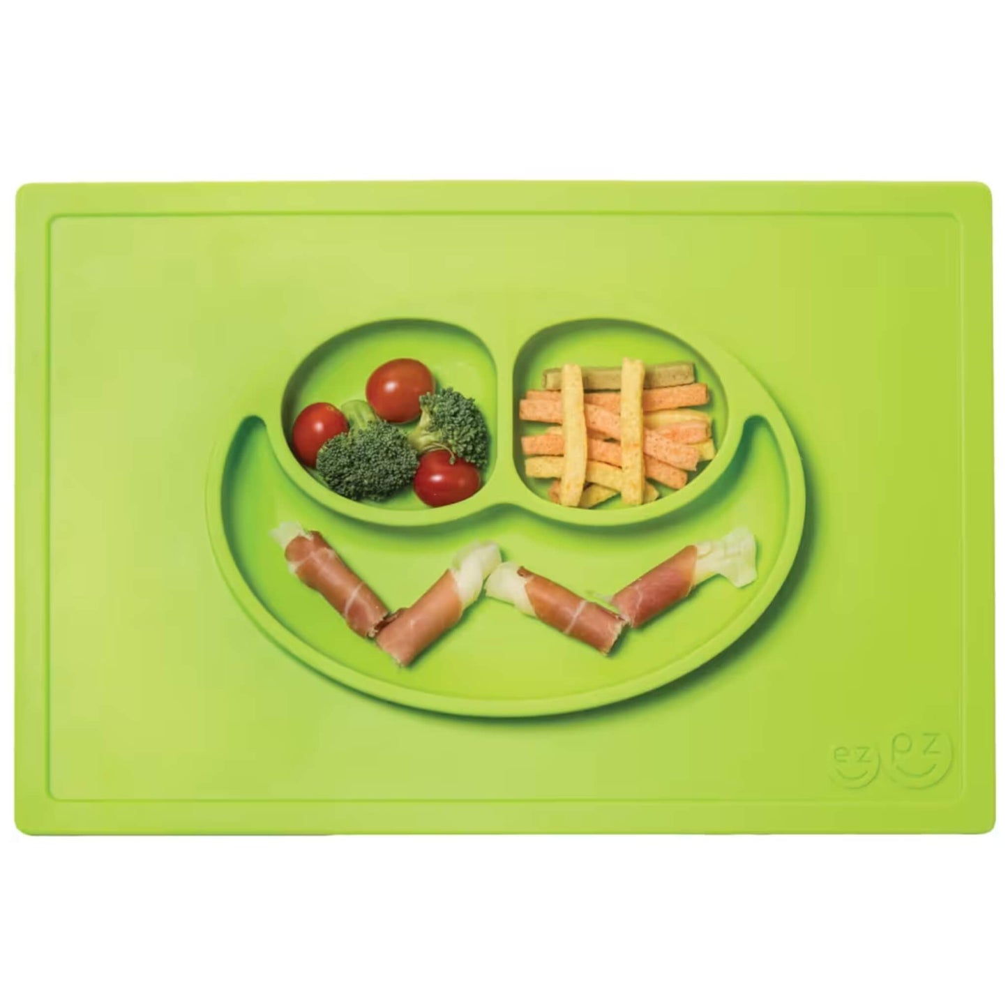 A lime green silicone placemat and plate filled with food, including tomatoes, broccoli, carrot sticks and ham rolls arranged in the compartments.