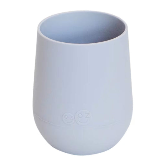 Ezpz Mini Cup in pewter, made from soft silicone with a non-slip base, designed as a toddler training cup for open cup drinking.
