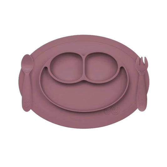 Ezpz Mini Feeding Set in Mauve shown with matching silicone mat, spoon, and fork designed for toddlers.