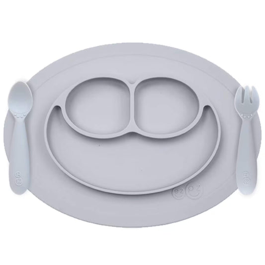 Ezpz Mini Feeding Set in Pewter shown with matching silicone mat, spoon, and fork designed for toddlers.