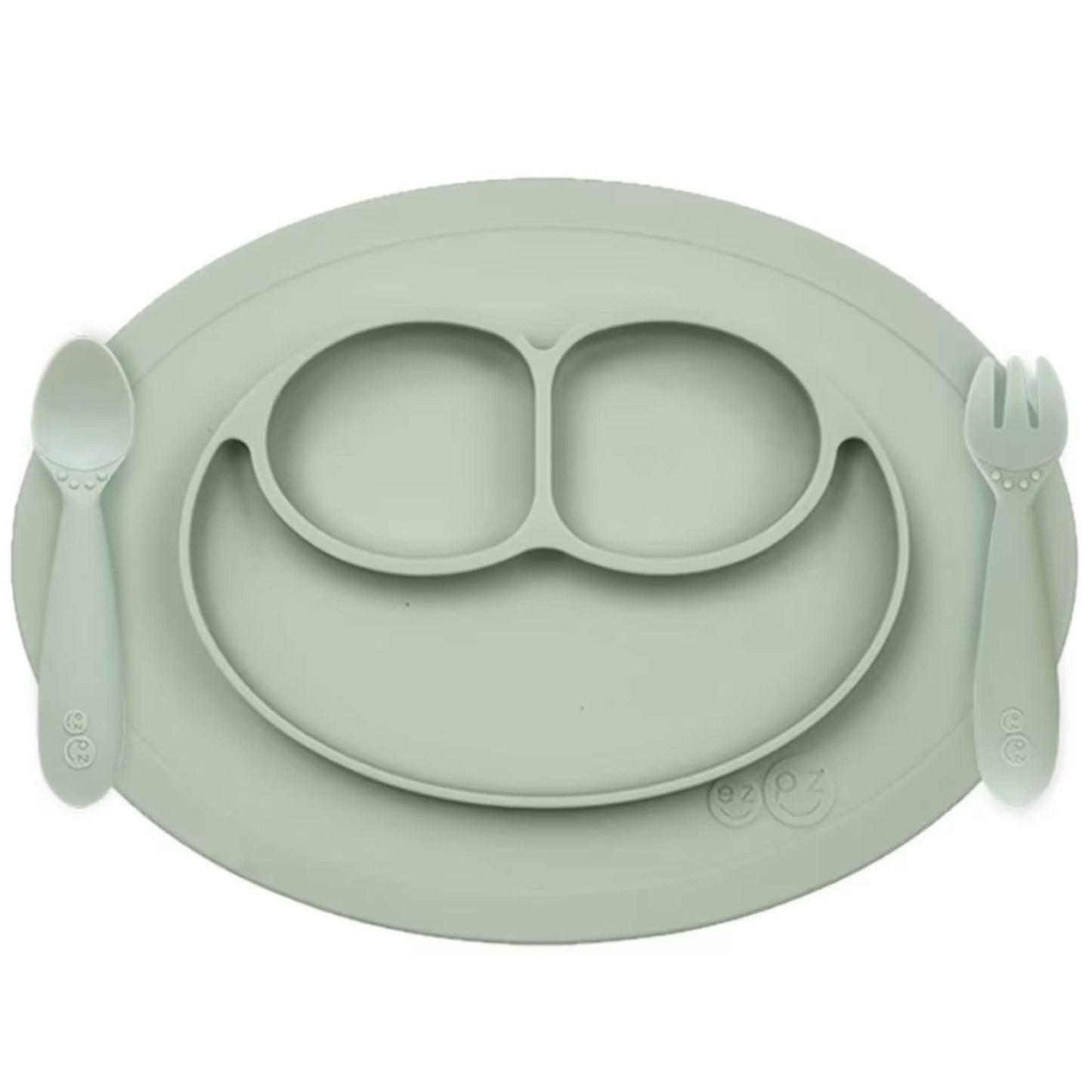 Ezpz Mini Feeding Set in Sage shown with matching silicone mat, spoon, and fork designed for toddlers.