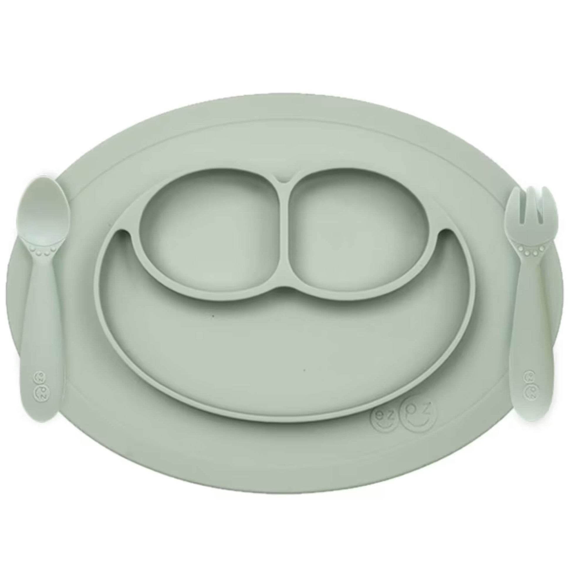Ezpz Mini Feeding Set in Sage shown with matching silicone mat, spoon, and fork designed for toddlers.