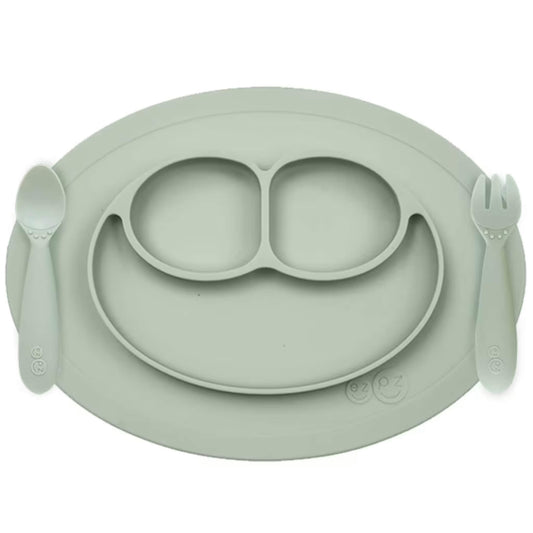 Ezpz Mini Feeding Set in Sage shown with matching silicone mat, spoon, and fork designed for toddlers.