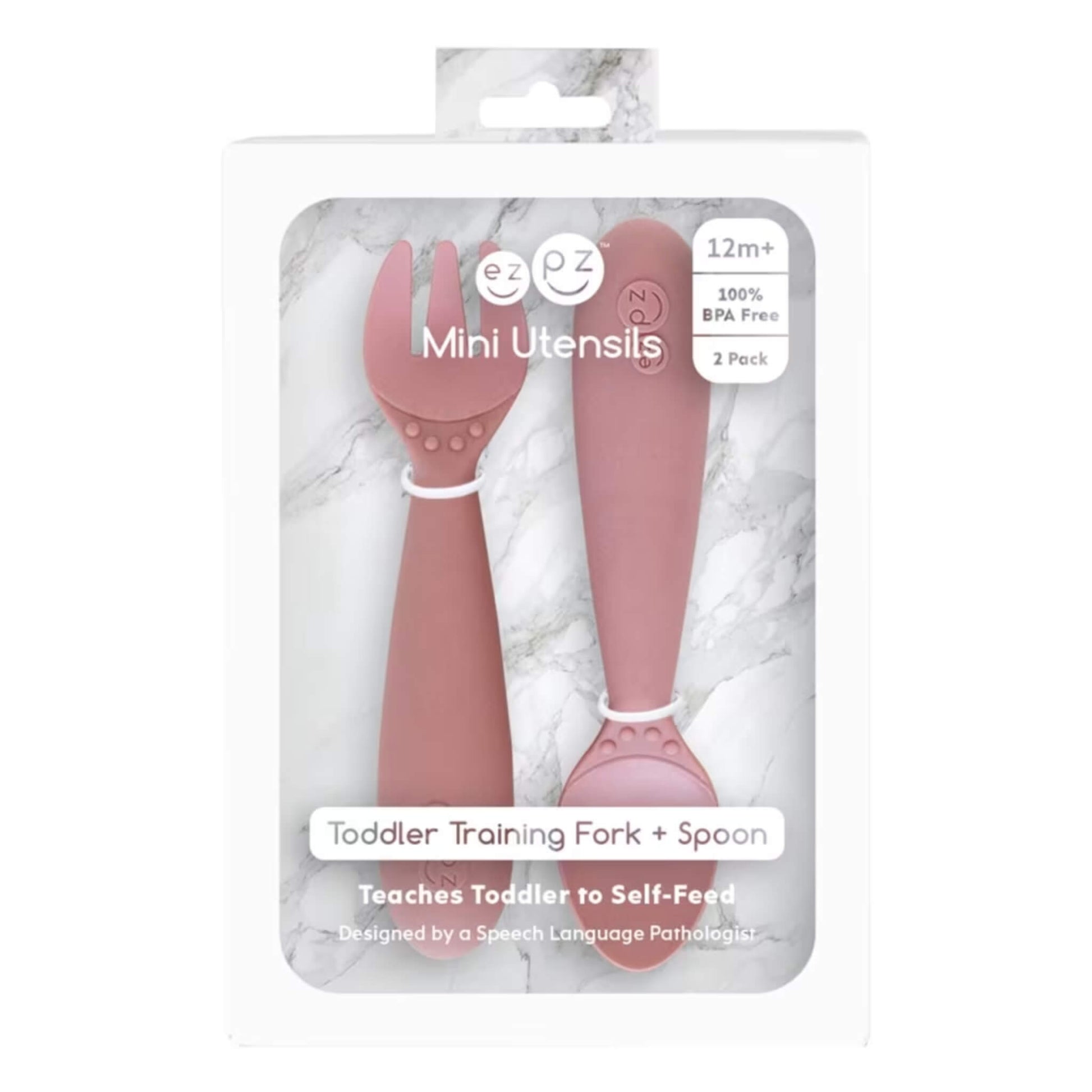 Boxed set of Ezpz Mini Utensils in Blush showing a toddler training fork and spoon displayed in retail packaging.