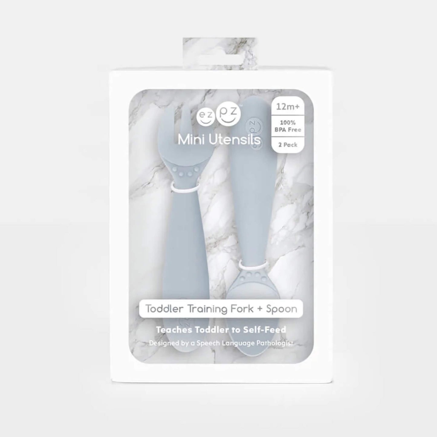 Boxed set of Ezpz Mini Utensils in pewter grey showing a toddler training fork and spoon displayed in retail packaging.