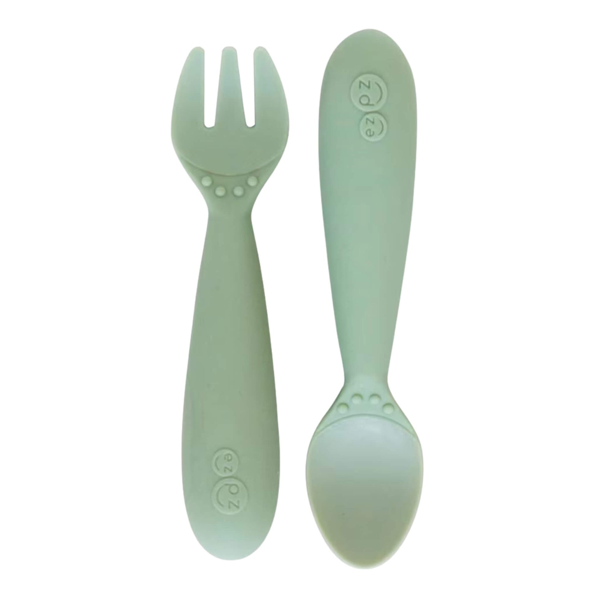Ezpz Mini Utensils in Sage, a silicone toddler fork and spoon set designed for safe self-feeding.