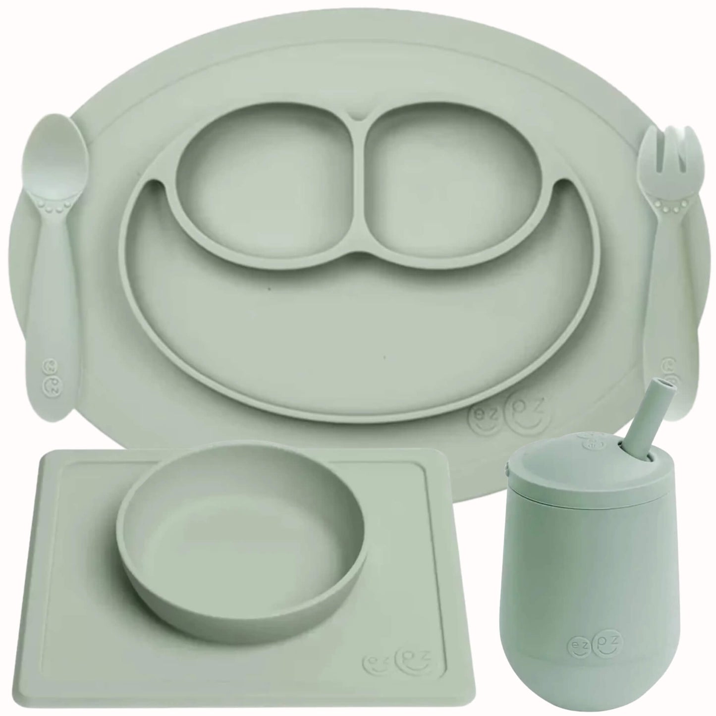 ezpz Self-Feeding Mealtime Bundle in sage featuring a silicone mini mat, spoon, fork, suction bowl with placemat and mini cup with straw.