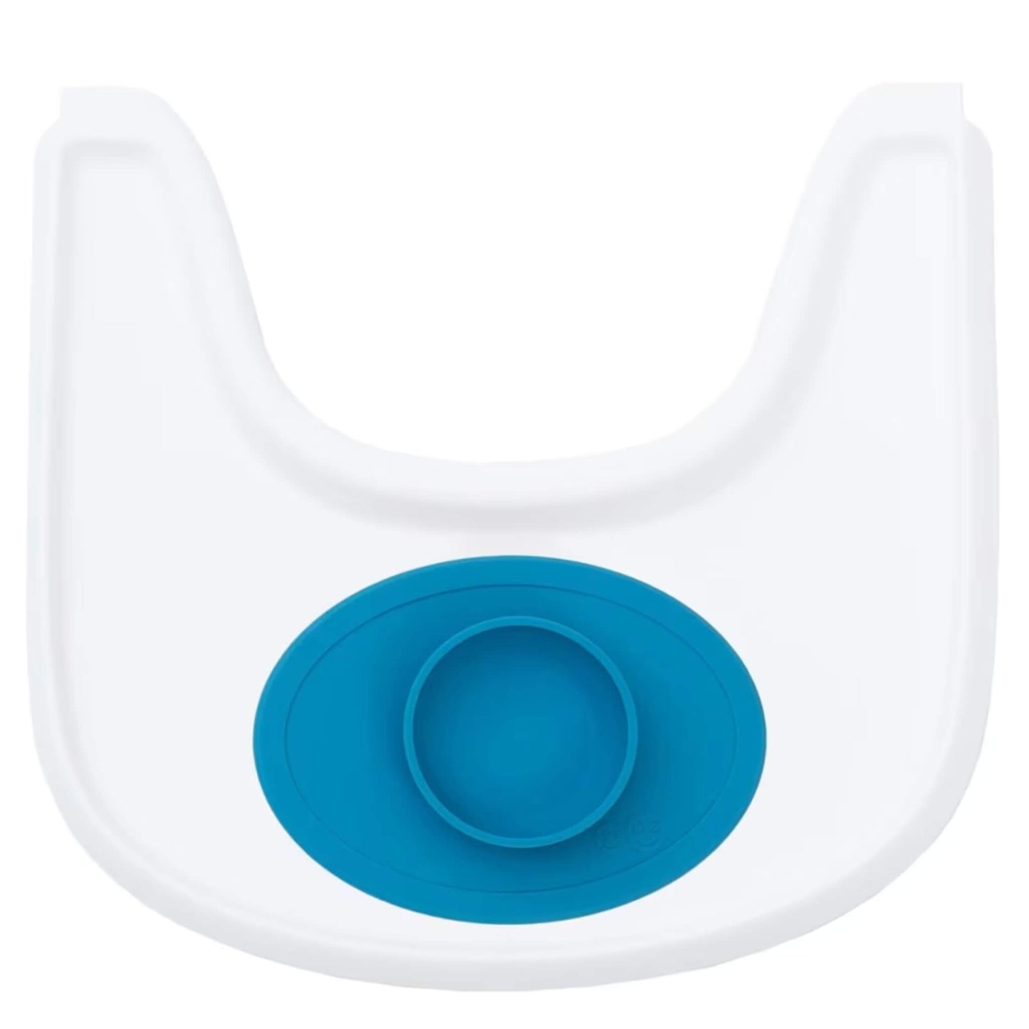 Small blue silicone placemat with attached bowl positioned on a white highchair tray to show fit and scale.