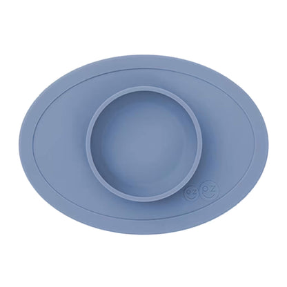 Ezpz Tiny Bowl in indigo, a silicone suction placemat with a built-in round bowl, shown empty against a plain background.
