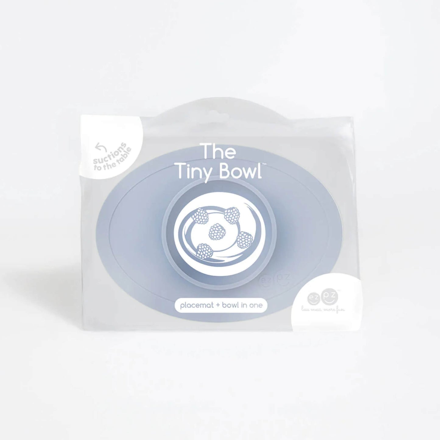 Clear retail packaging showing a silicone suction placemat with integrated bowl in indigo colour.