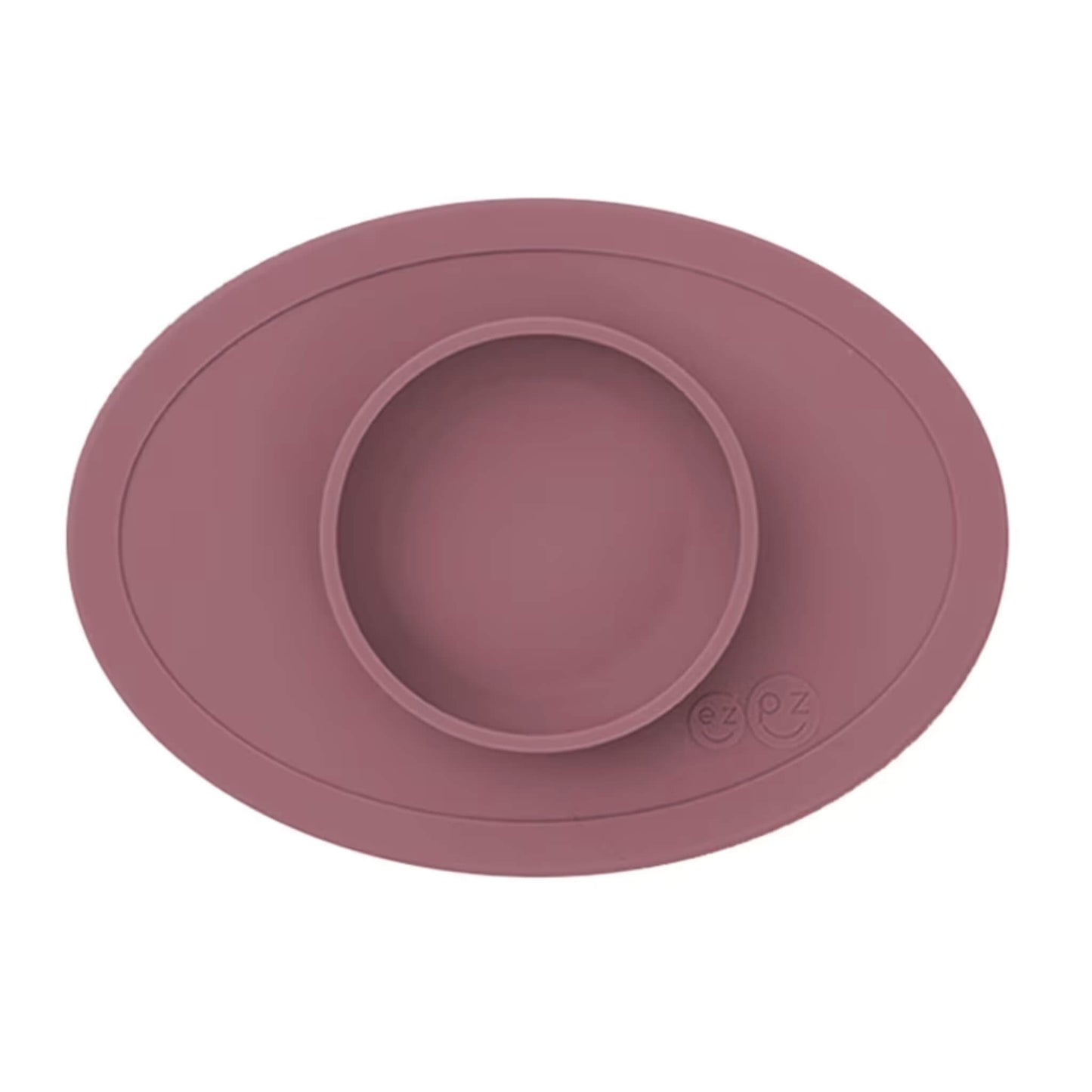 Ezpz Tiny Bowl in mauve, a silicone suction placemat with a built-in round bowl, shown empty against a plain background.