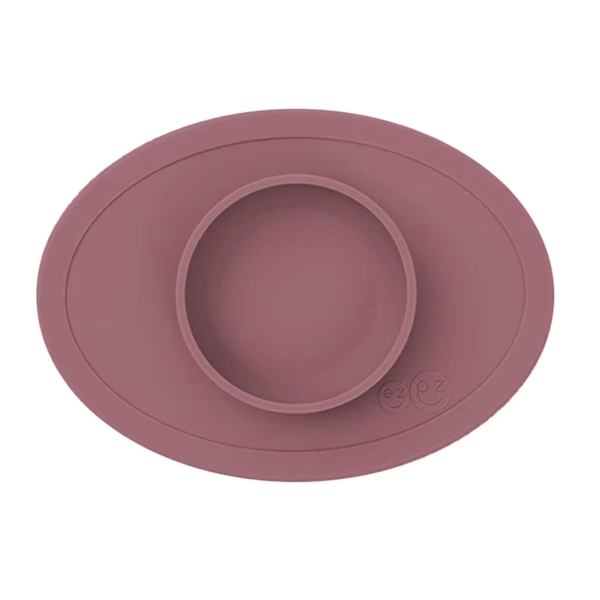 Ezpz Tiny Bowl in mauve, a silicone suction placemat with a built-in round bowl, shown empty against a plain background.