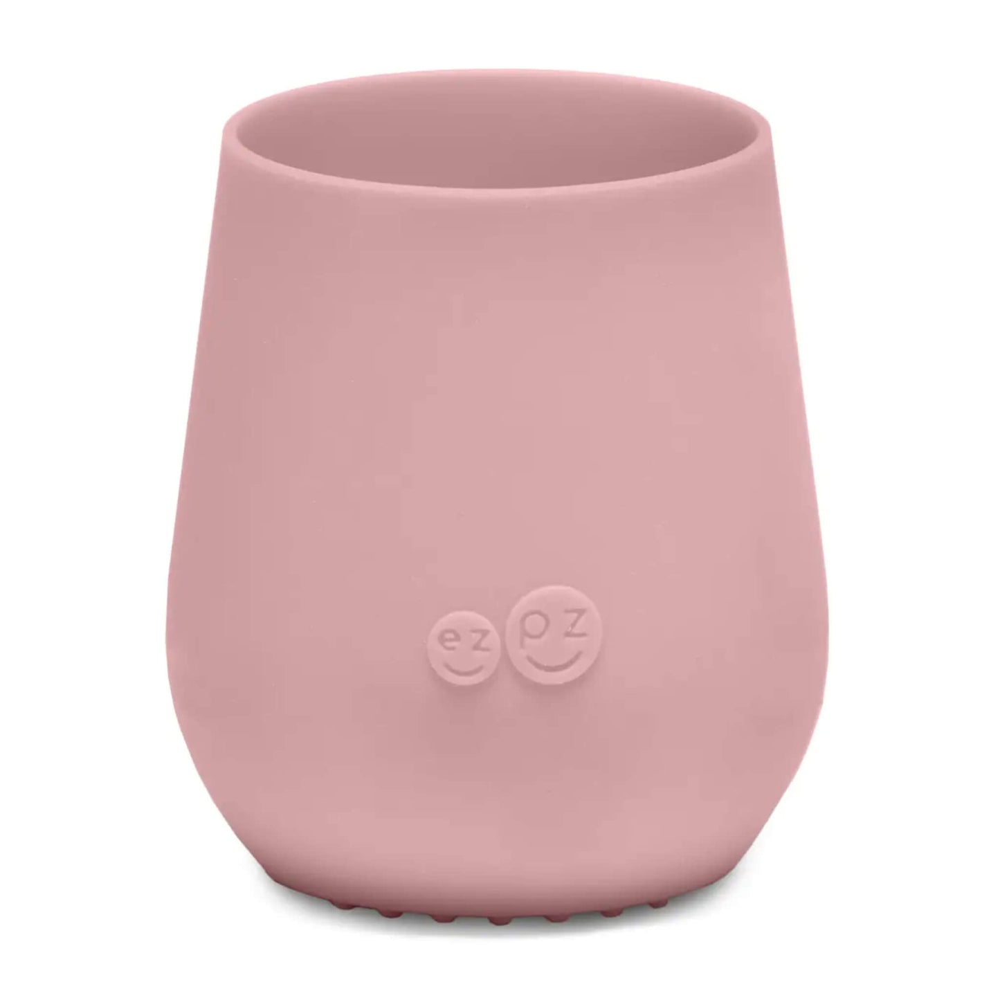 ezpz Tiny Cup in blush pink shown from the front with a smooth tapered shape and subtle embossed logo on the centre.