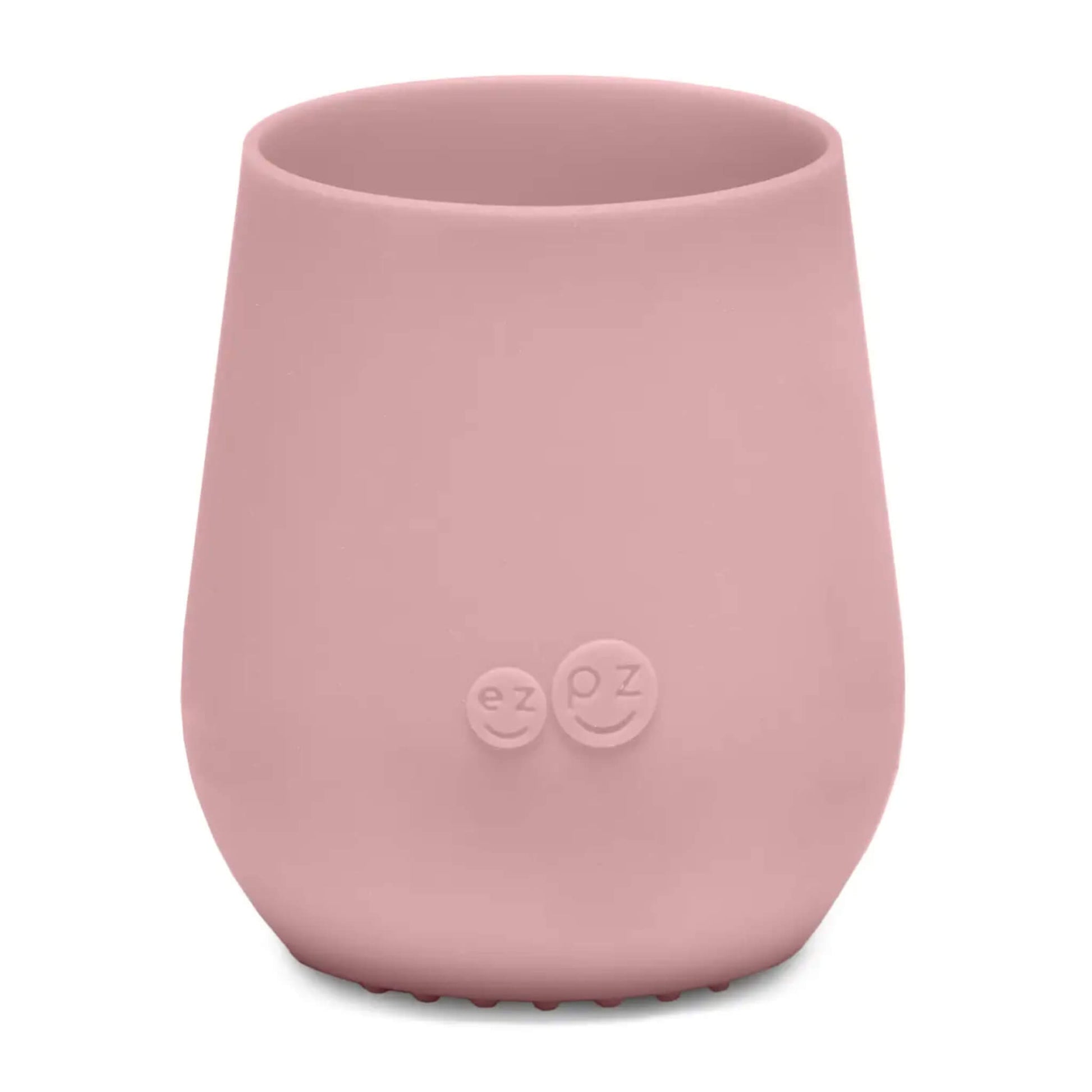 ezpz Tiny Cup in blush pink shown from the front with a smooth tapered shape and subtle embossed logo on the centre.