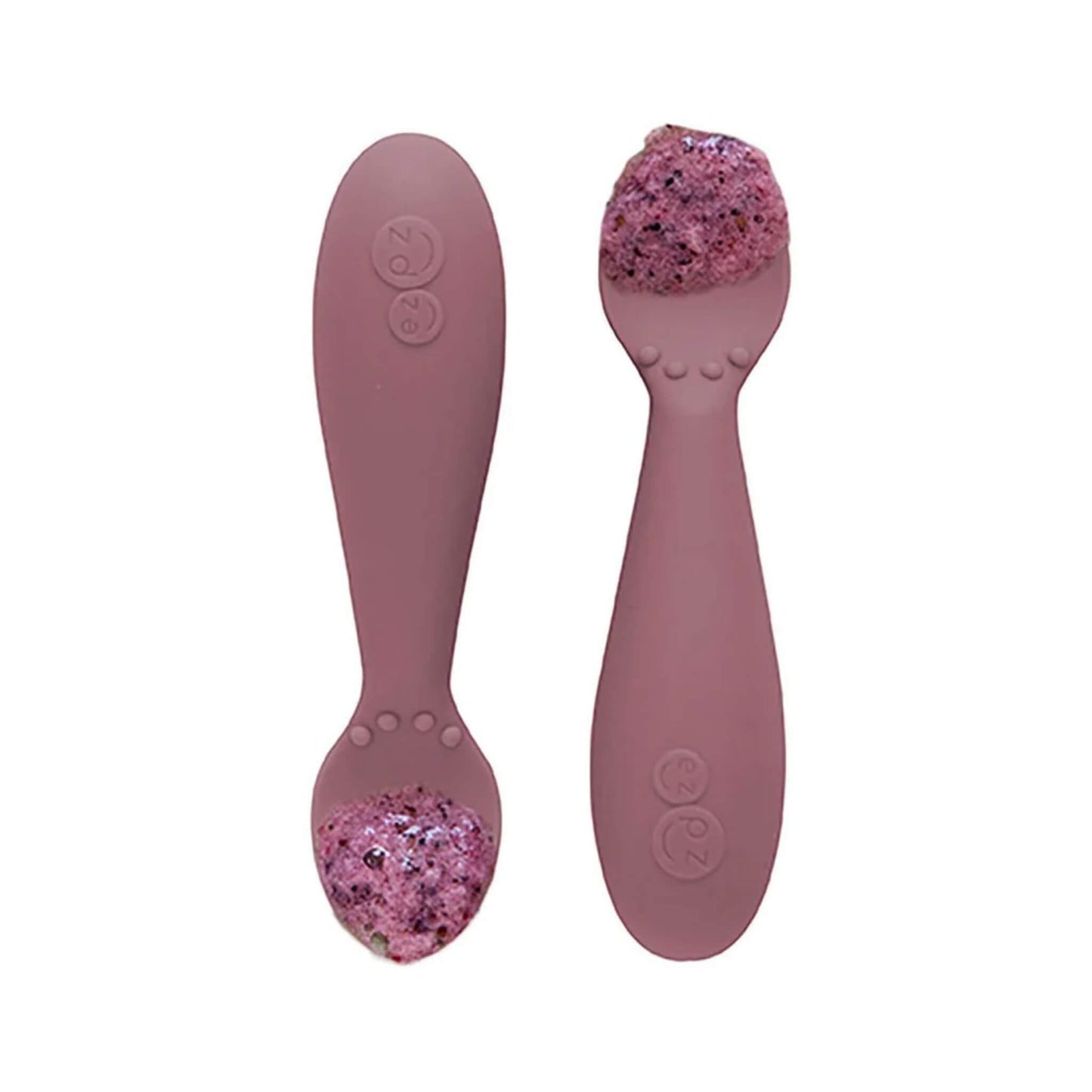 Pair of mauve silicone training spoons, each filled with a serving of purple baby food, shown close-up.