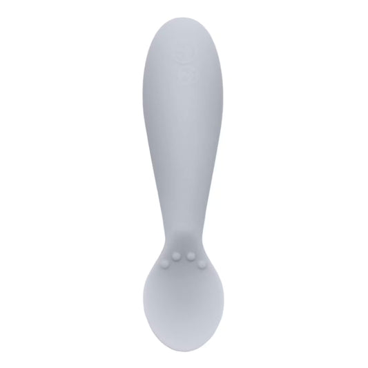Single pewter grey silicone infant training spoon with shallow head and small textured bumps on the handle.