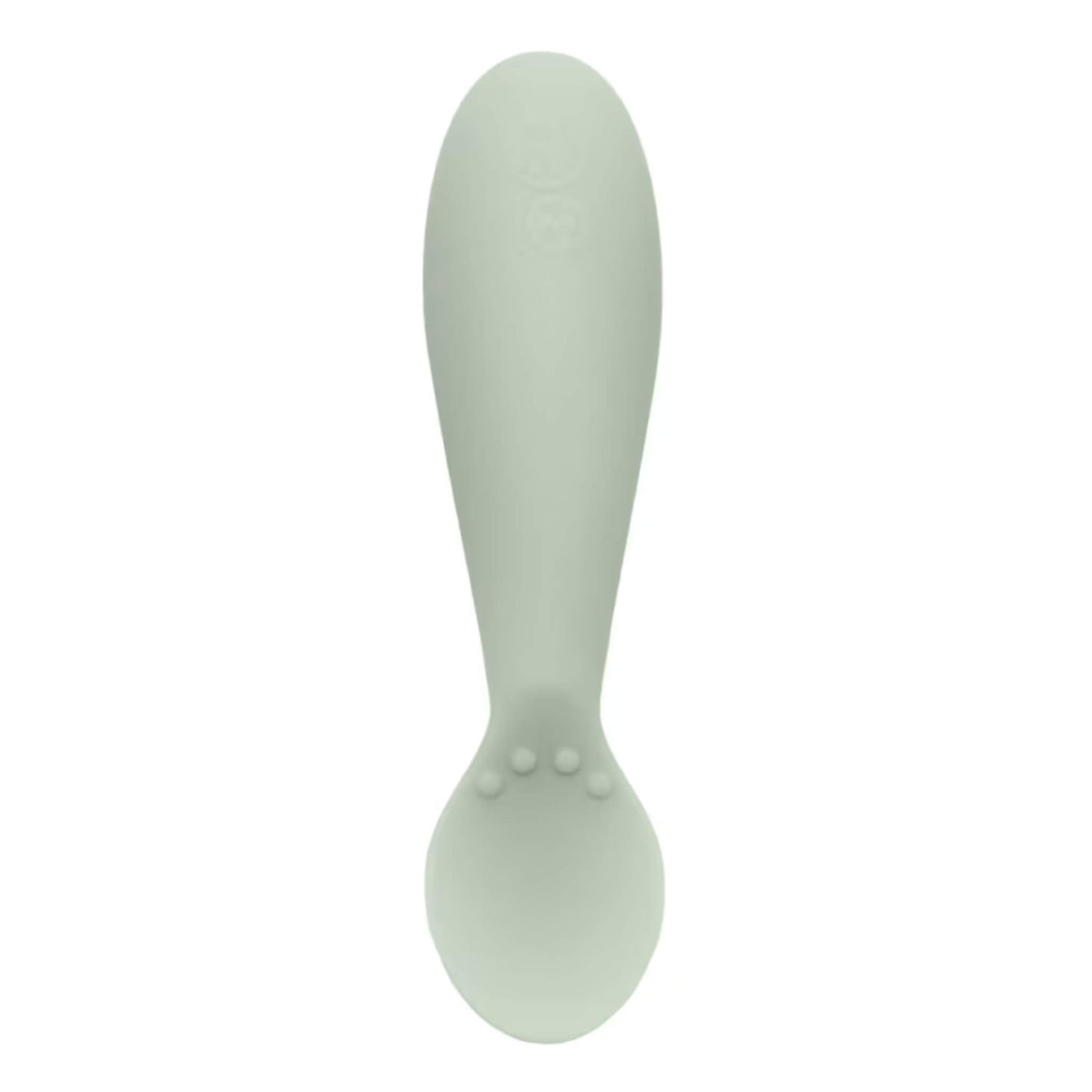 Single sage green silicone infant training spoon with shallow head and small textured bumps on the handle.