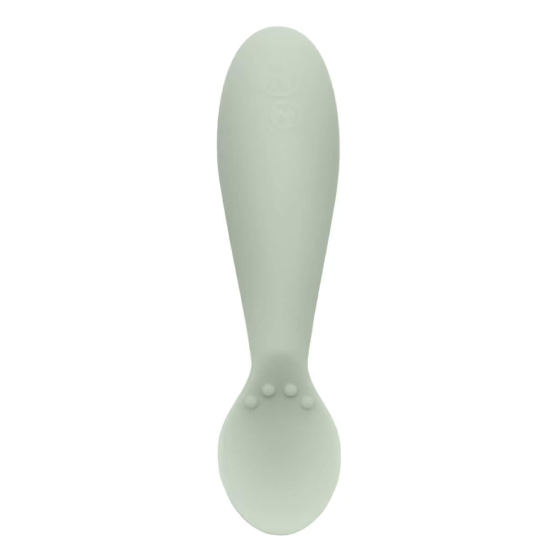 Single sage green silicone infant training spoon with shallow head and small textured bumps on the handle.
