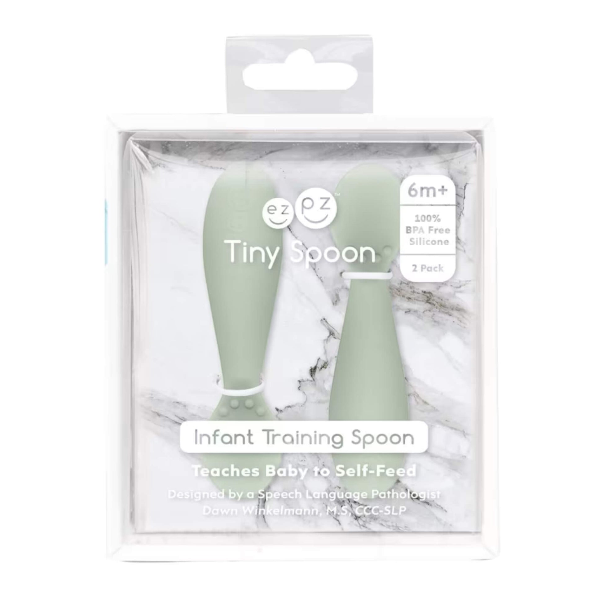Retail packaging of Ezpz Tiny Spoons two-pack in sage green, labelled “Infant Training Spoon” with product details on clear display box.