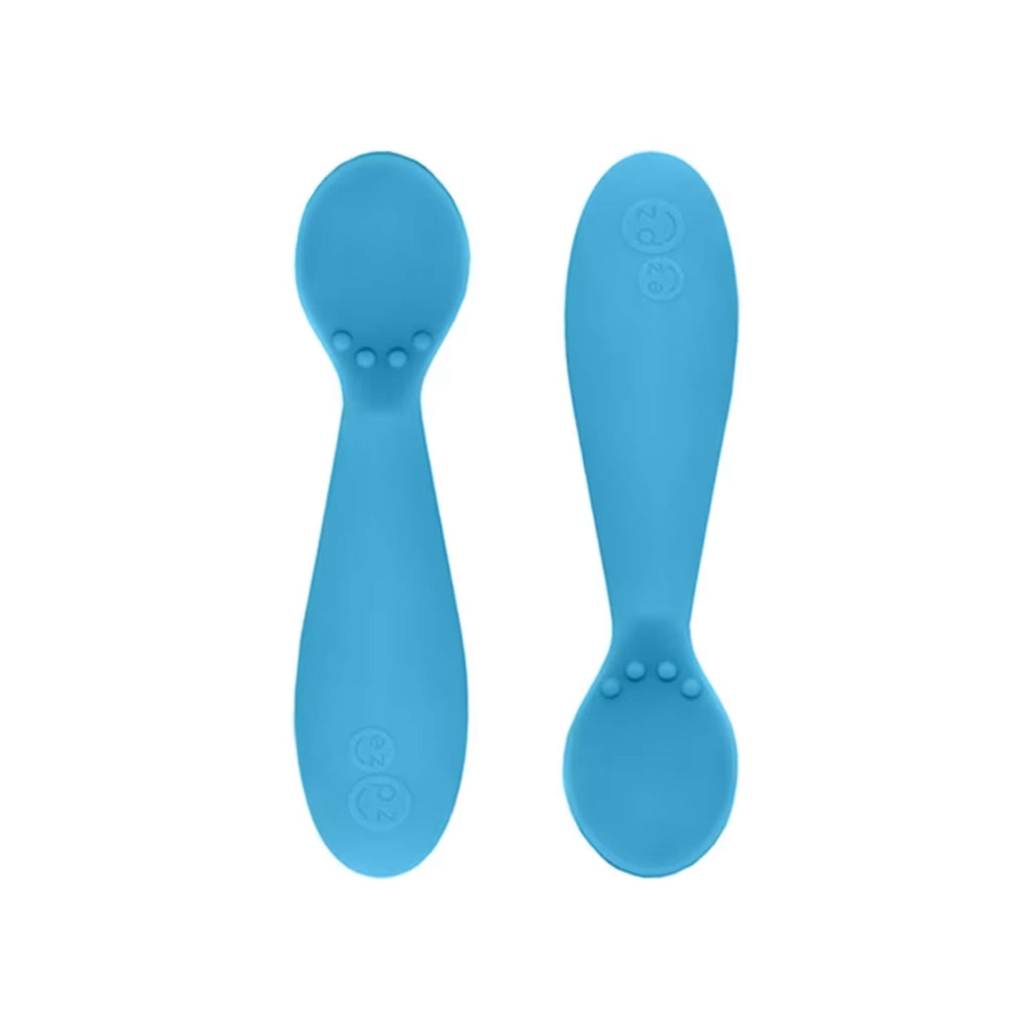 Ezpz Tiny Spoons in blue, a pair of infant training spoons made from soft silicone, shown front and back against a plain background.