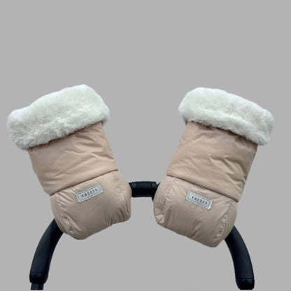 Beige pram gloves with white faux fur cuffs attached to a stroller handle, viewed from the front.